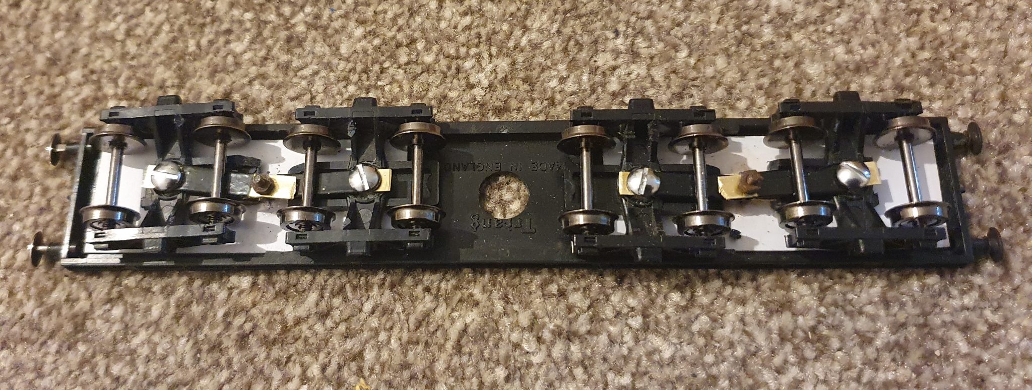 The underside, showing how how each bogie is pivoted as well as each pair being pivoted.